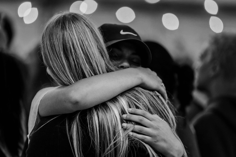 Woman comforting another women